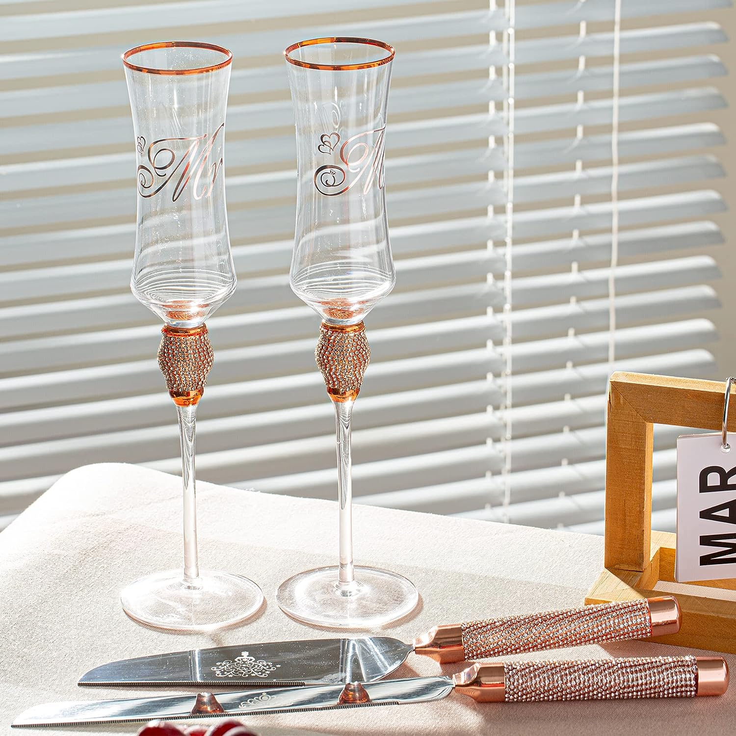 https://varlka.com/cdn/shop/products/wedding-toasting-flutes-and-cake-server-set-champagne-flutes-bride-and-groom-toasting-champagne-glasses-for-wedding-gifts-cake-cutting-set-for-engagement-gifts-854643.jpg?v=1699263726